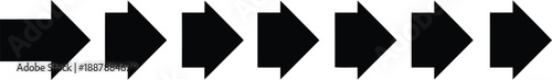 A series of black arrows pointing in different directions on a plain surface viewed from directly above