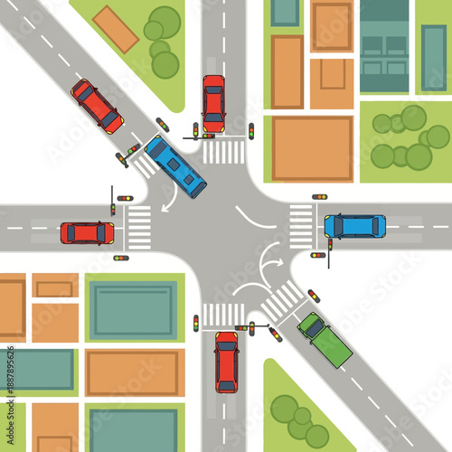 Aerial view of busy intersection with cars, bus, and traffic lights in a city.