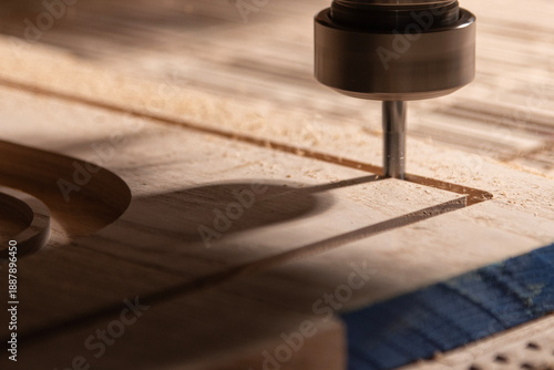 A CNC router machine is precision-carving wood.