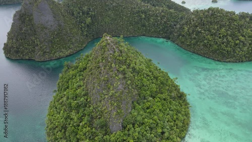 Raja Ampat, Indonesia: Aerial drone footage of the famous wayag viewpoint plateform overlooking a stunning lagoon in in Raja Ampat in west Papua in Indonesia.
