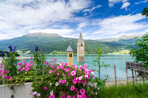 Bild auf Leinwand Submerged church tower of Alt Graun in Lake Reschen in South Tyrol, Italy