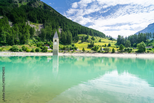 Submerged church tower of Alt Graun in Lake Reschen in South Tyrol, Italy