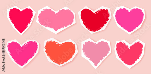 Set of hand drawn hearts in various shapes and shades of pink and red, created with pencil, brush, and crayons on cut out sheet of torn paper. Isolated design elements for Valentine's Day, weddings.