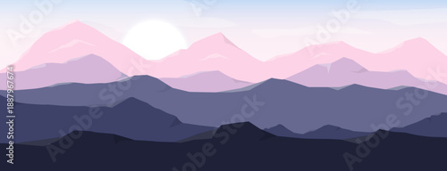 Misty mountains in the morning with soft fog and rising sun over a peaceful landscape