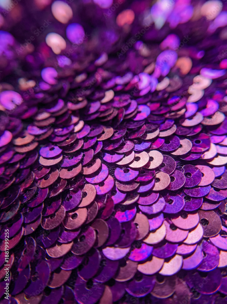 Obraz premium Close macro of iridescent purple and rose sequins reflecting light