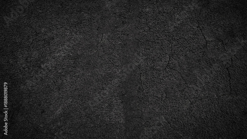 Dark and Textured Dry Earth Surface with Cracks and Crevices