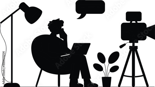 Content creator workspace silhouette with laptop, camera, lighting and speech bubble representing blogging, video production and digital media creation concept
