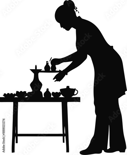 Silhouette Of A Woman Setting A Haft Sin Table