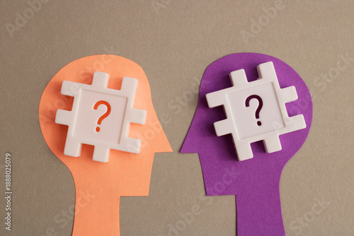 Minds exchange questions to solve a problem, question marks and puzzle pieces
