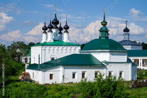 Konstfotografi Ancient white monastery with green roofs and onion domes