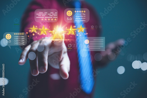 Hand of a customer giving a five-star customer feedback rating online.