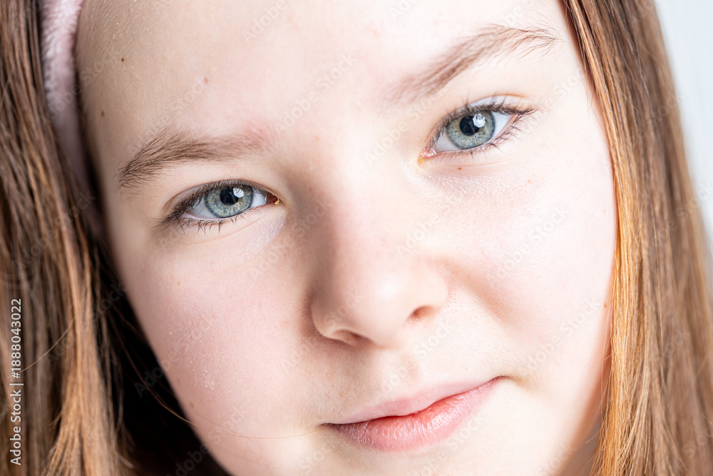 Fototapeta premium Close-up portrait of a little teenage girl.