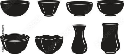Collection of eight black ceramic cups and vases