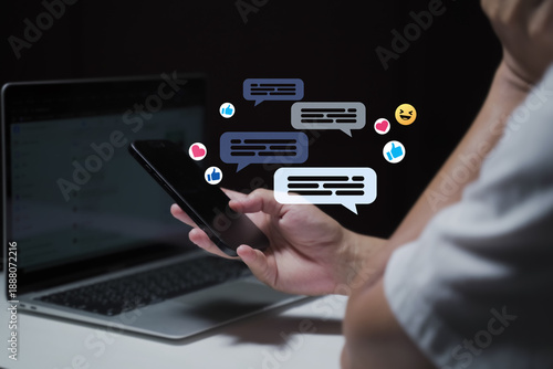 A man's hand is using a laptop or smartphone to chat on social media; communication concept, social networking, contact, online.