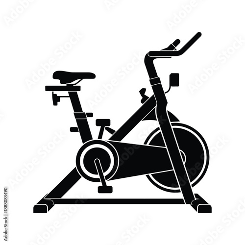 Black silhouette of an indoor exercise spinning bike with pedals