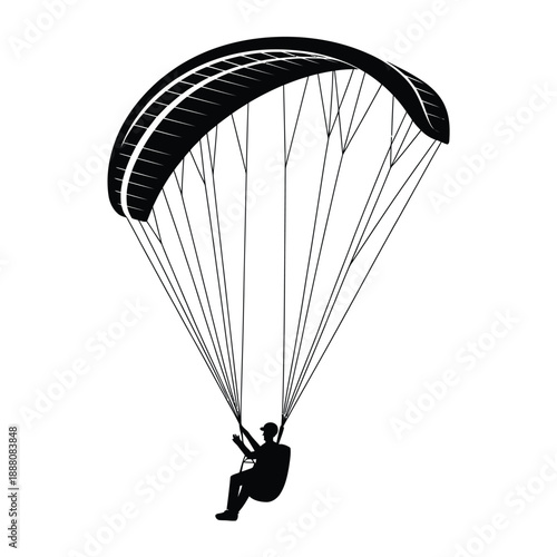 A silhouetted paraglider gracefully descends through the open air