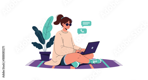 Young woman sitting cross-legged on a striped rug uses her laptop for remote work, study, or communication in a relaxed environment.