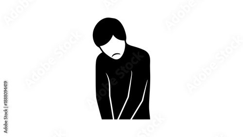 Sad person standing alone with head down