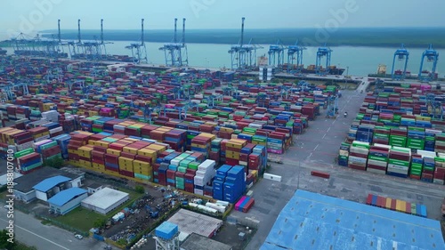 Huge Container port cargo containers cranes. Lovely aerial view drone
