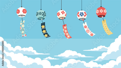 Colorful Japanese glass wind chimes hang from a clear blue summer sky filled with fluffy white clouds for a traditional seasonal atmosphere.