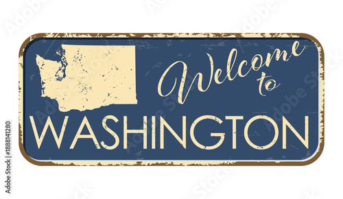Welcome to Washington. A worn blue plaque with the name and outline of the state. Welcome inscription on the road sign