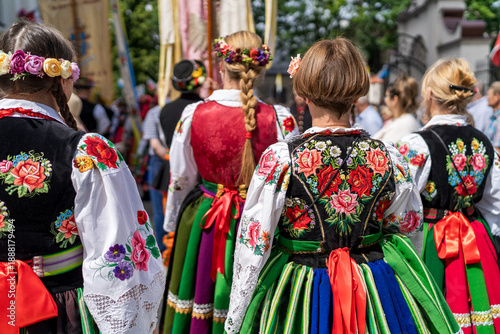 Women in traditional embroidred Polish folk costumes from Masovia region at Łowicz Corpus Christi procession	