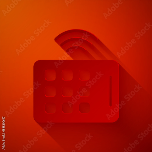 Paper cut Wireless tablet icon isolated on red background. Internet of things concept with wireless connection. Paper art style. Vector