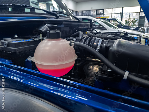 Tank of liquid antifreeze of the cooling system of the car radiator system. Tank with antifreeze close-up