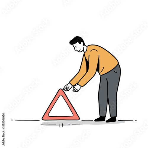 Man placing red warning triangle on white background  
