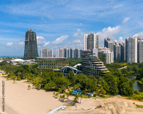 Aerial panoramic view of Forest City in Johor, Malaysia with a blue sky and clouds as background.
