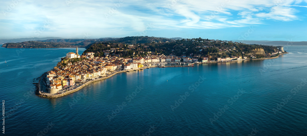 Fototapeta premium Aerial 12K panorama of Piran old town peninsula and lighthouse cape Adriatic sea Slovenia High Resolution