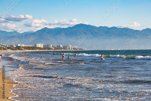 North America, Mexico, Nayarit, Bahia de Banderas, Nuevo Vallarta. Bucerias. Waves. Playing in the surf.