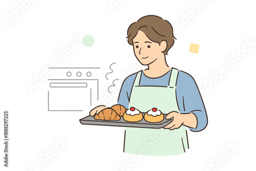 Young asian male baker holding freshly baked bread and pastries
