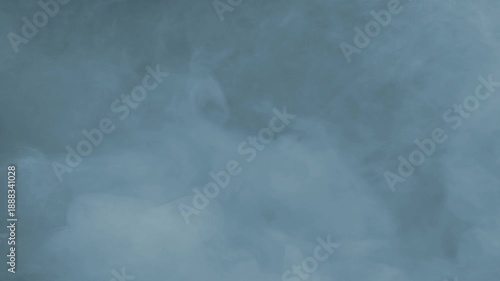 Slowly Moving Fog Blue Tint on Black 4K Loop features slow rolling fog or smoke with a blue tint in a loop.