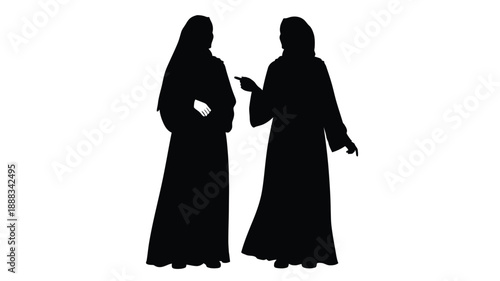 Two women in traditional dress stand and converse a striking silhouette