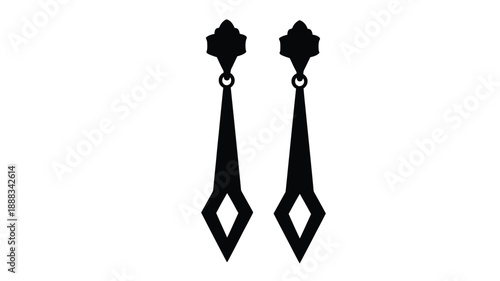 Two ornate black earrings displayed against a white background silhouette