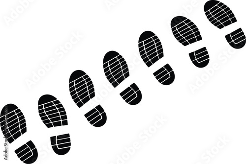 Black shoe prints in a diagonal line across a white background footprint