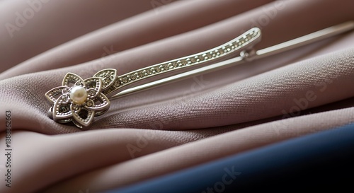 Silver Hairpin with Flower on Fabric.