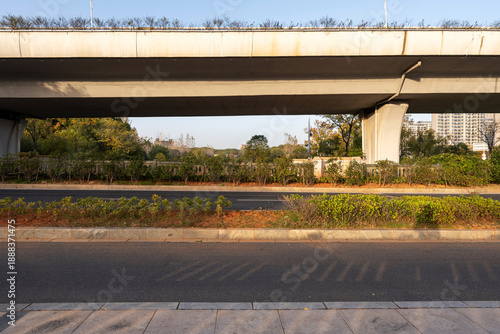 Concrete structure and asphalt road space under the overpass in the city