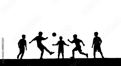Players kick ball during intense outdoor soccer match on field
