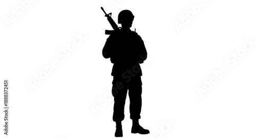 Silhouette of a soldier holding a rifle, standing alone, viewed from the side