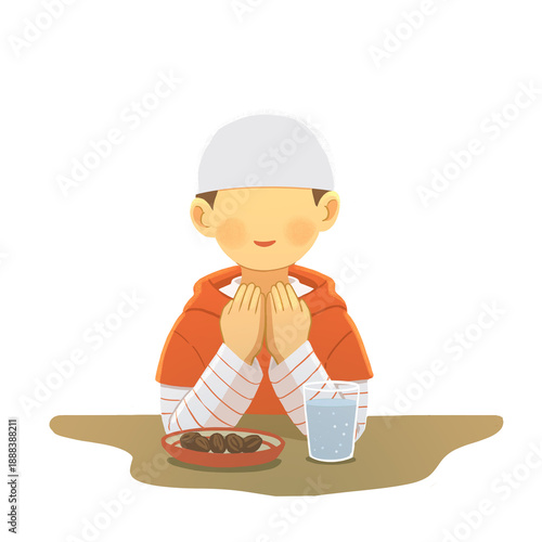 Muslim Boy Praying Before Meal During Ramadan, a Boy Praying while waiting for the iftor