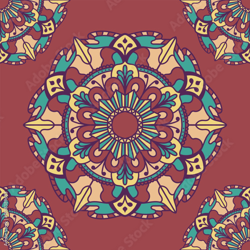 This seamless mandala pattern features layered floral shapes in warm brown, teal, and cream tones, arranged in a calm circular composition. Made for repeating layouts on fabric, wallpaper.