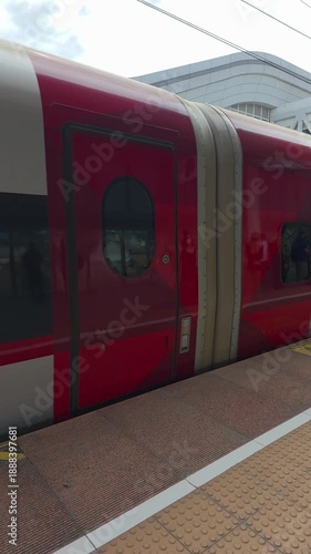 Slow motion video of a high speed train arriving at a station. Indonesia's high speed trains are moving to transport passengers