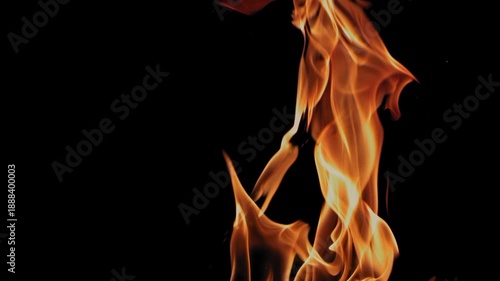 Close-up of a burning flame against a black background.