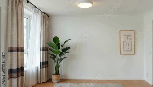 Minimalist Living Room with Large Plant and Artwork.
