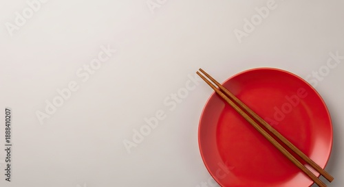 Red plate with chopsticks