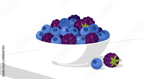 A bowl of fresh blueberries and blackberries