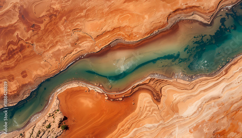Aerial View of a Winding River Through Arid Desert Landscape.