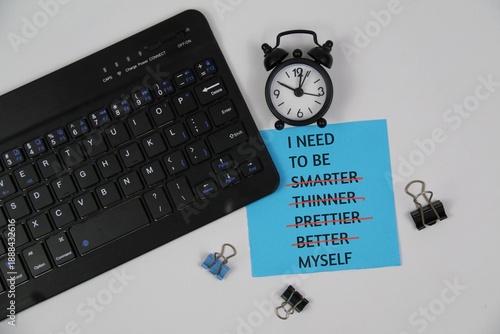 Symbol of being yourself. Memo pad with the words 'I NEED TO BE MYSELF', not smarter, thinner, prettier, better. White background. Psychological concept, being yourself in the workplace environment.